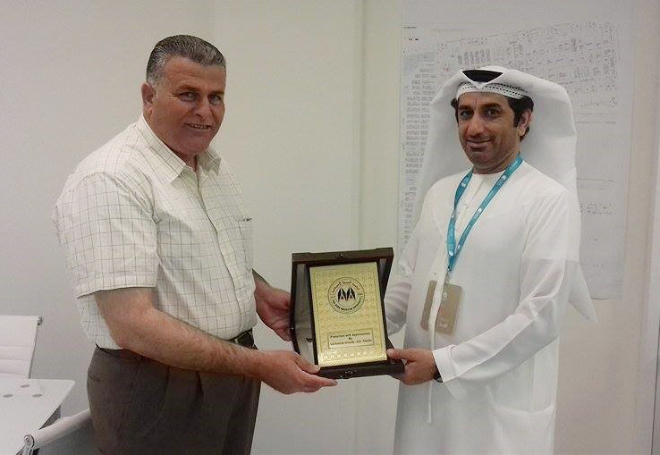 Honoring Director of the Book Authority in Abu Dhabi International book fair Abdullah Majid AL-Ali with the university shield