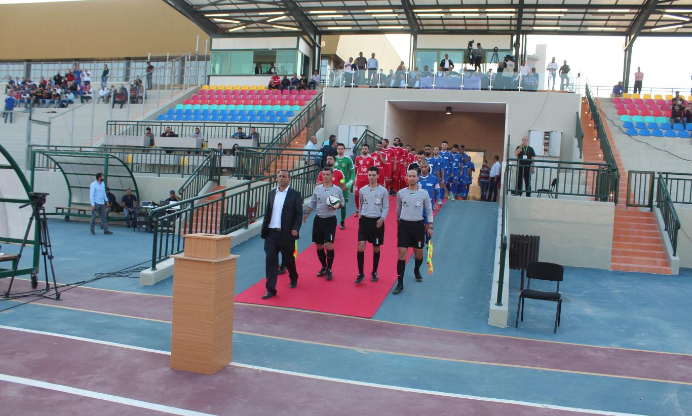 The teams entering the field