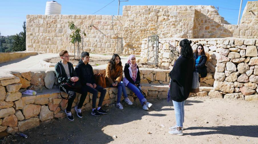 Interior Architecture students of AAUP while listening to an explanation about the old town of Kofor Aqab in their field trip to the place